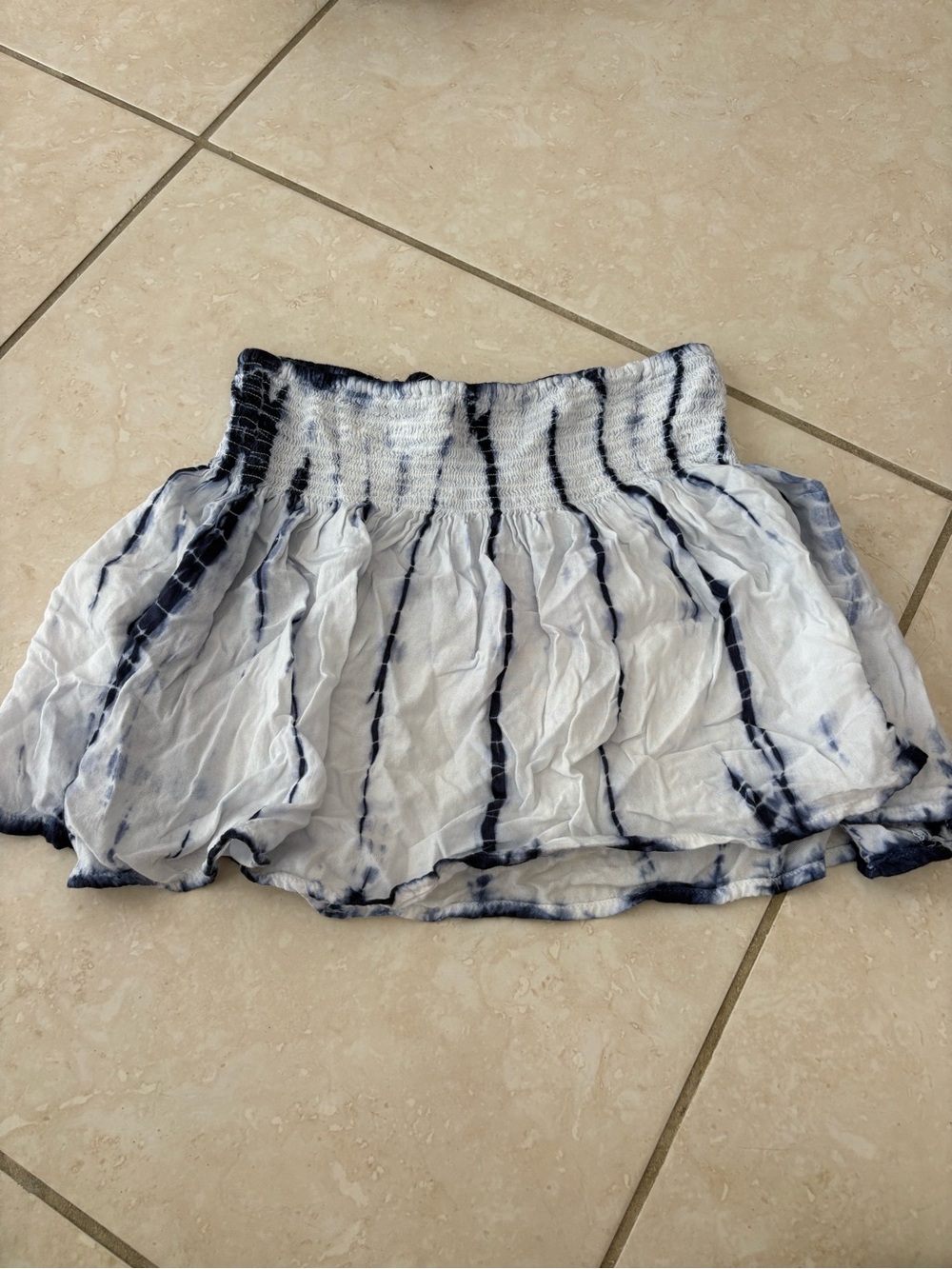 Blue and white tie-dye mini skirt with elastic waistband. Size: XS